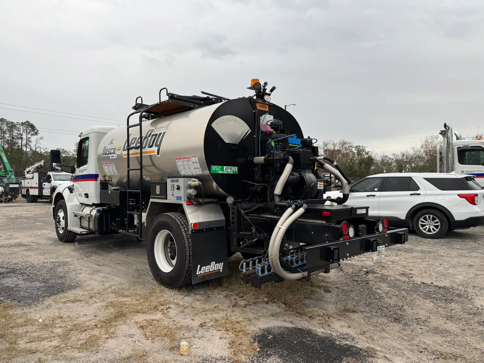 Paving Trucks with Automatic Reverse Braking Systems