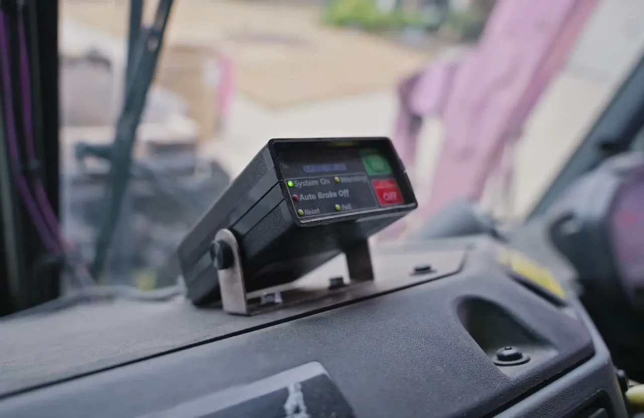 Reverse braking control box mounted on a truck dashboard